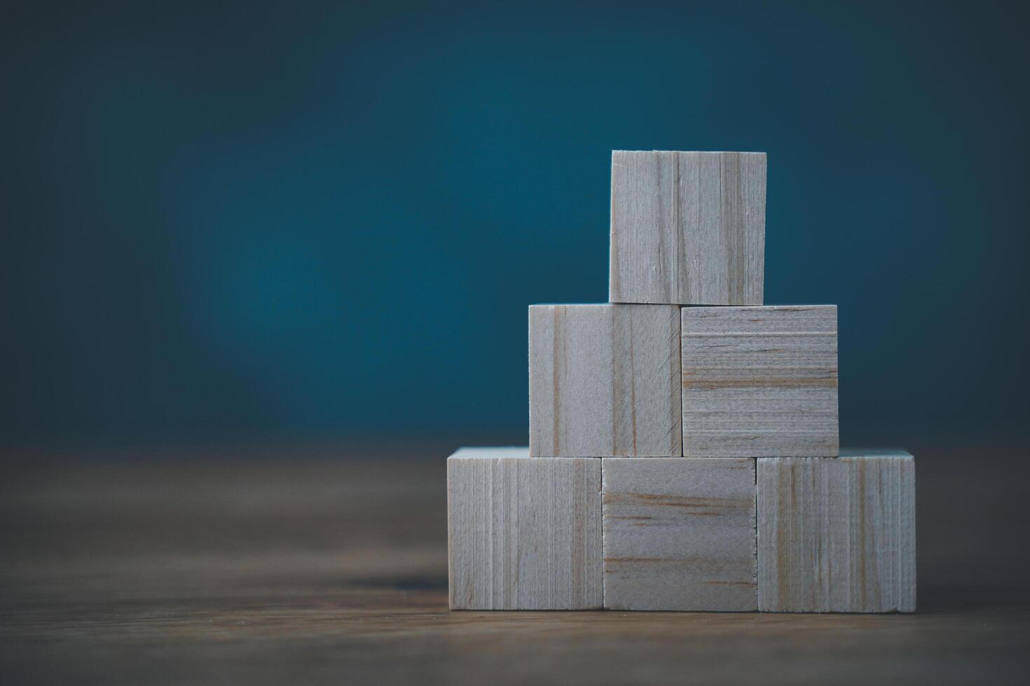A stack of wooden blocks on a table photo