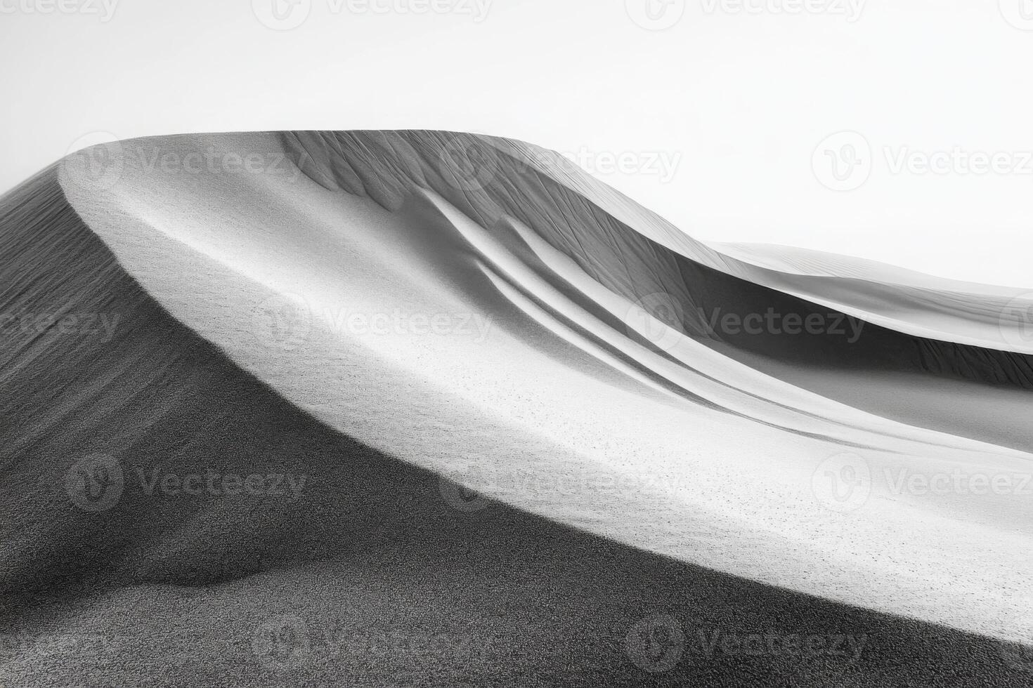 Wind patterns on the sand forming smooth curves, minimalistic desert scene photo