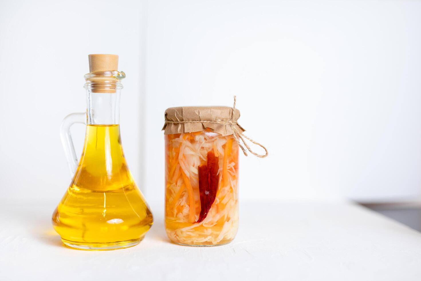 three jars of sauerkraut and carrots in its own juice. traditional home-made, fermented dish of Russia and Germany. photo