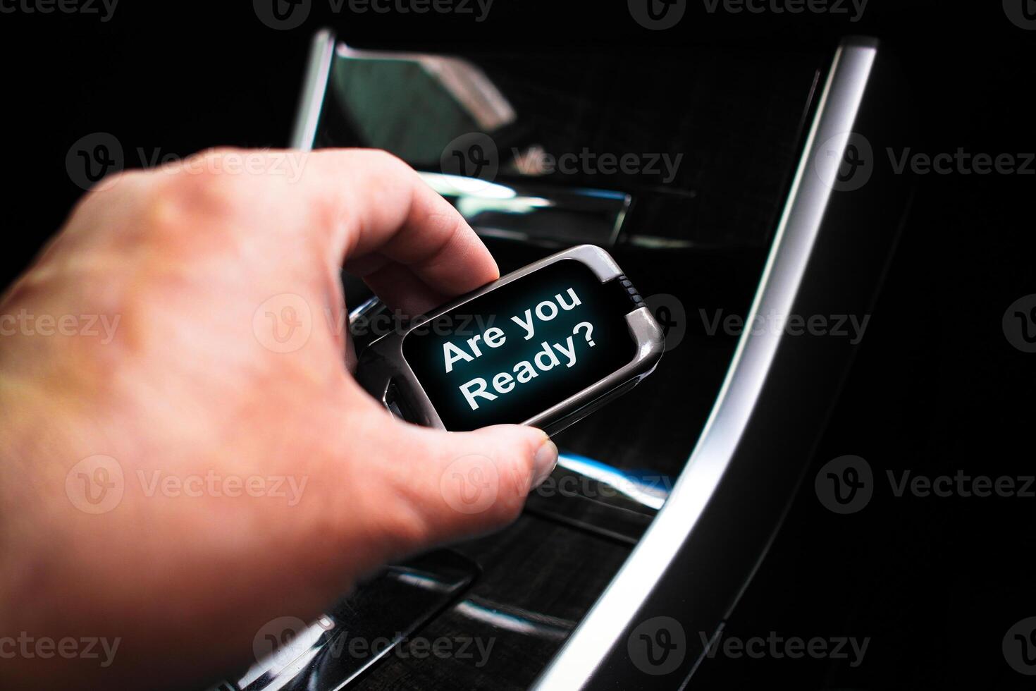 Are you ready , Messages displayed on the car remote screen in the driver hand photo