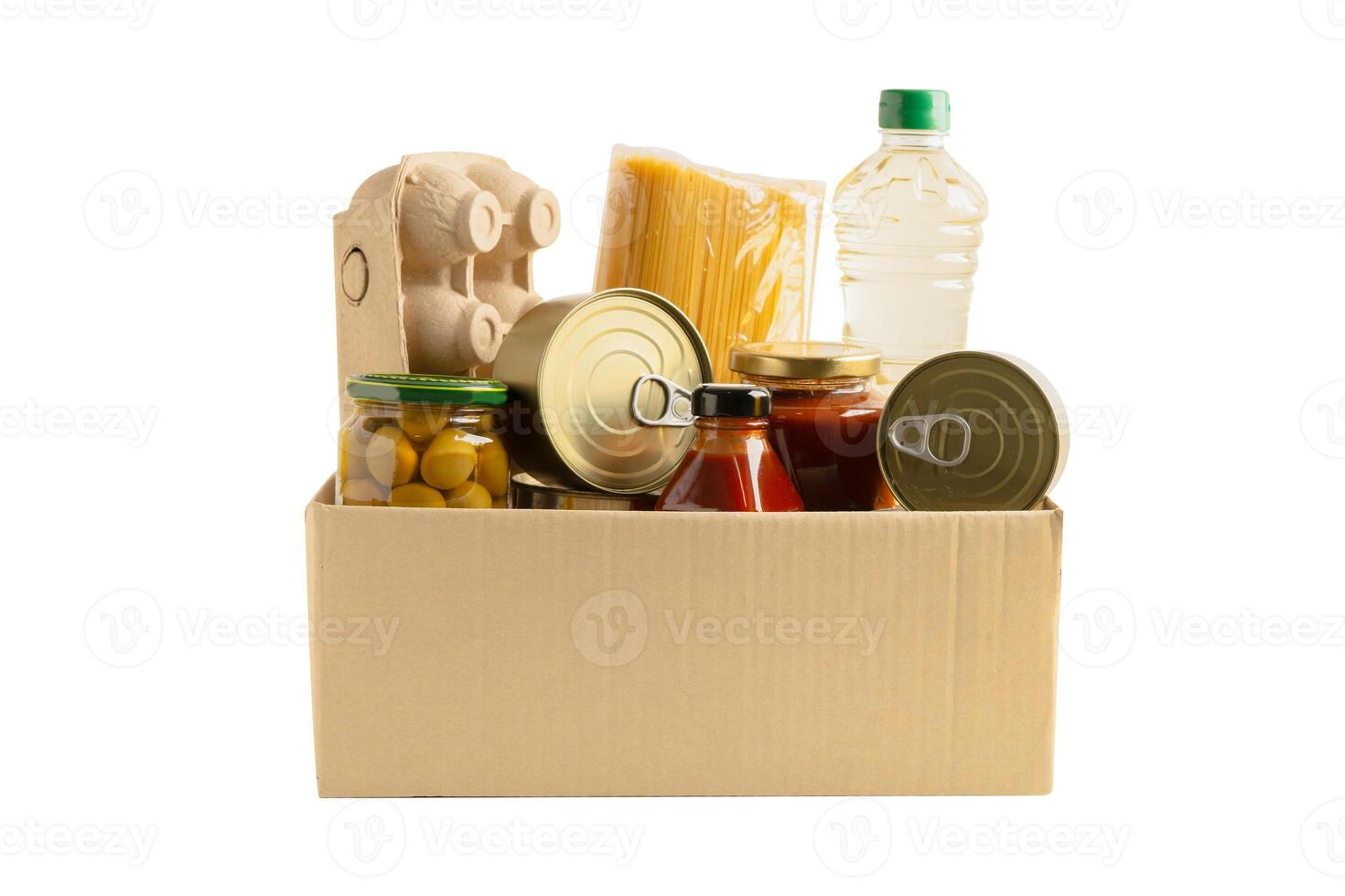 Foodstuff for donation isolated on white background with clipping path, storage and delivery. Various food, pasta, cooking oil and canned food. photo