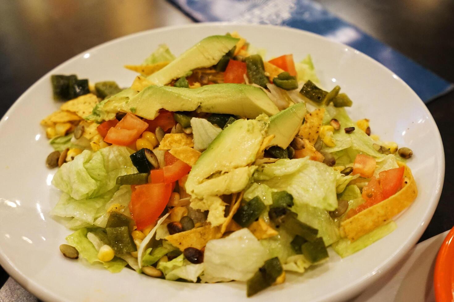 Close up fresh green salad with balsamic vinegar sauce photo