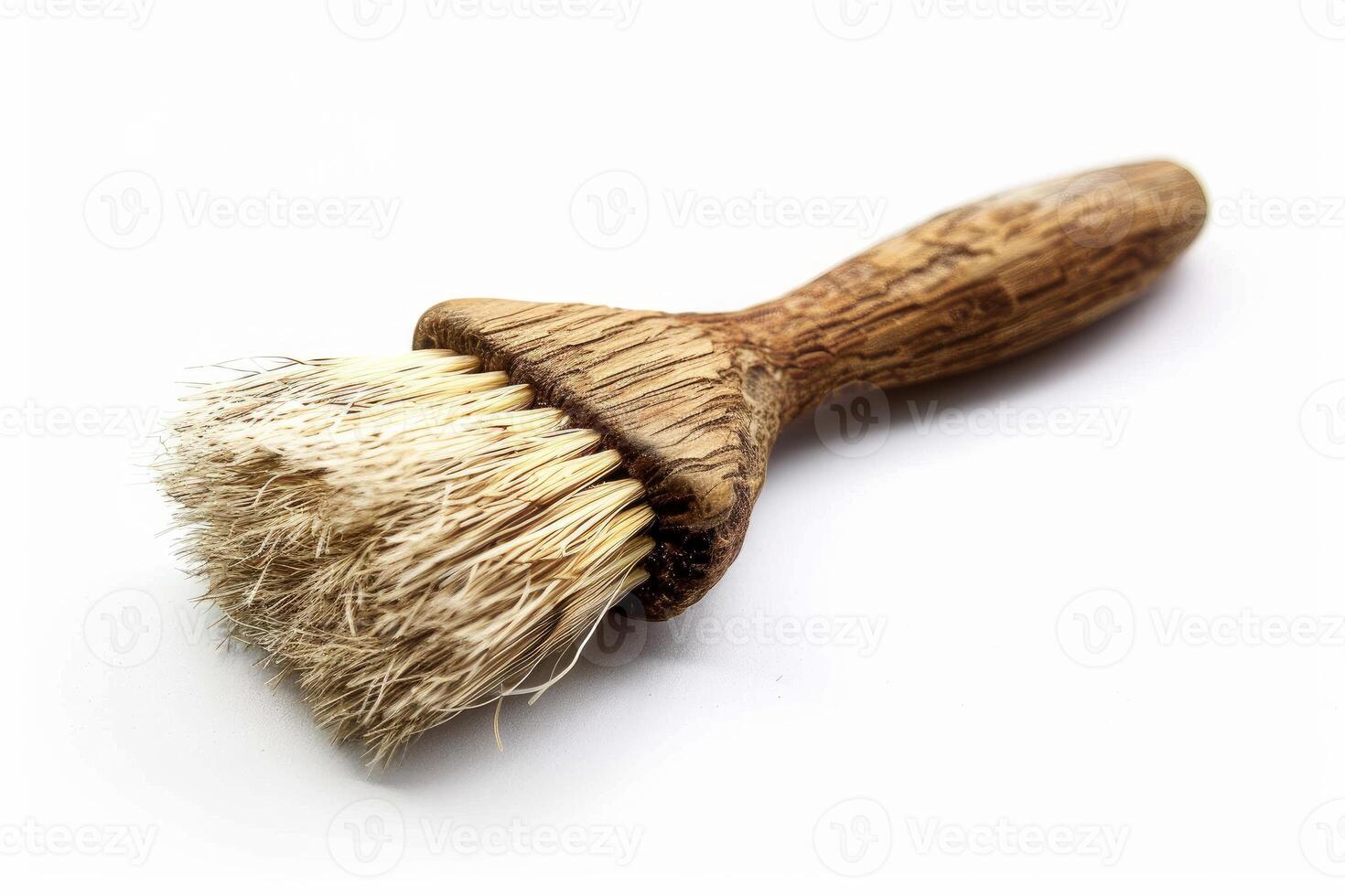 Small scrubbing brush with natural bristles lying on white background photo