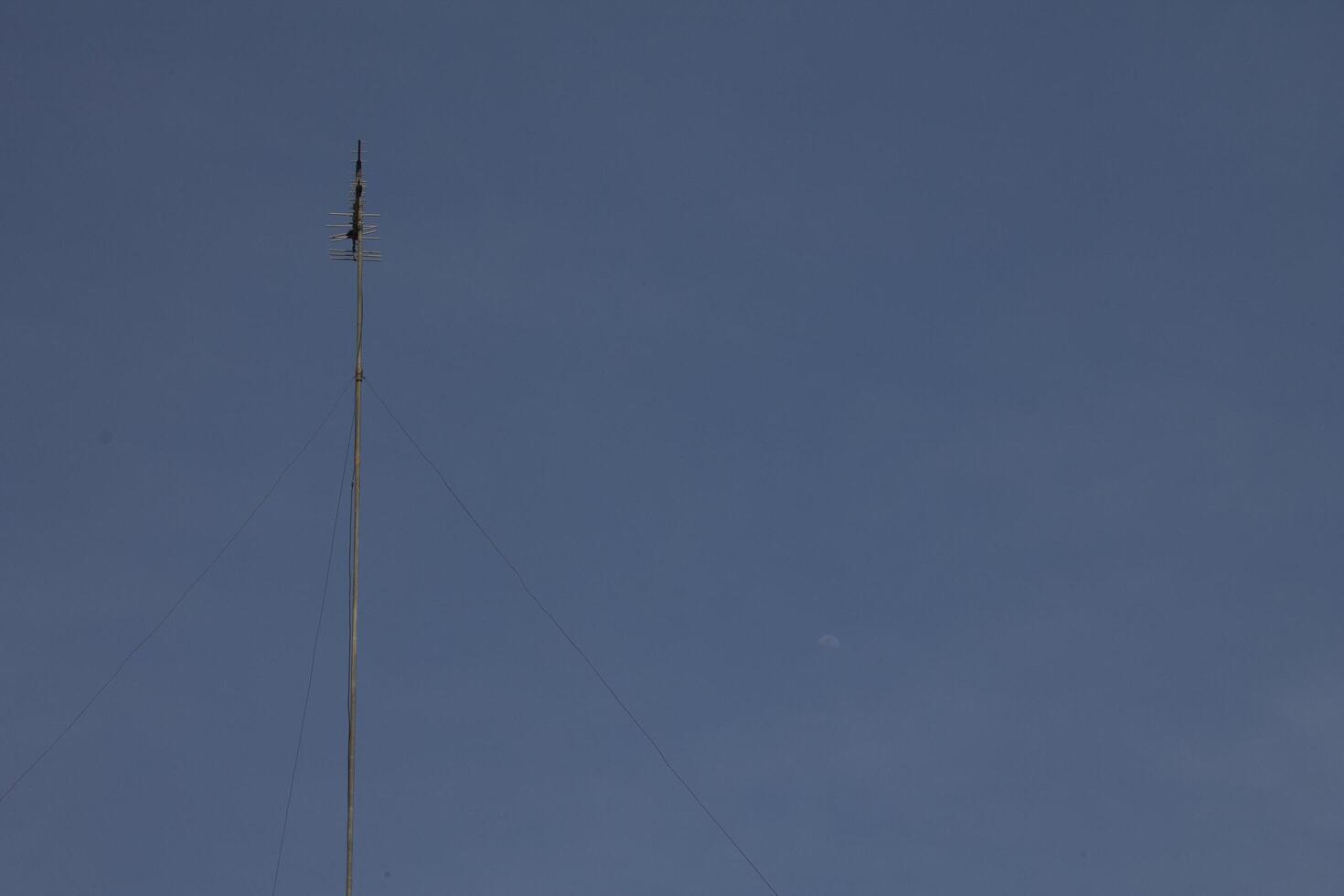 television antenna mast with sky background photo