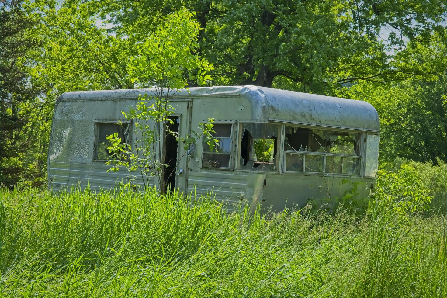 Trailer abandoned in a field photo