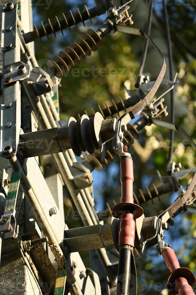 a close up of a power pole with wires attached photo