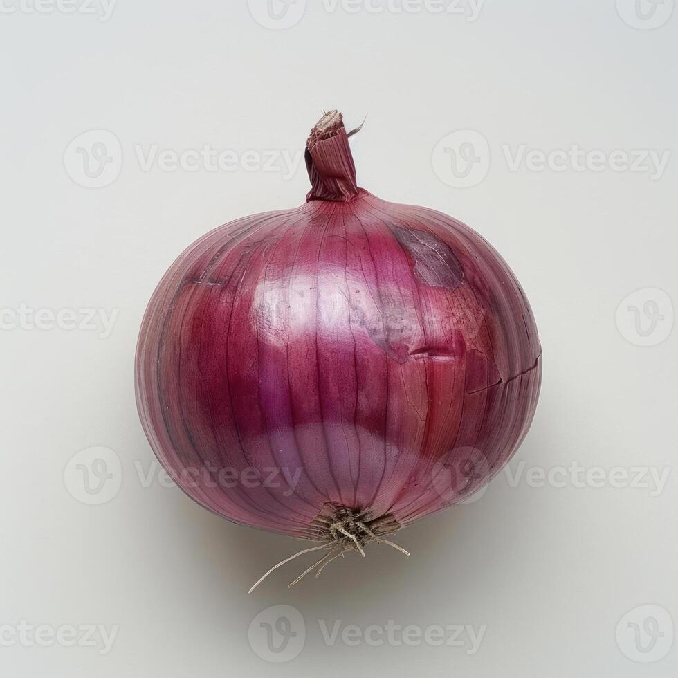 a close up of a red onion on a white surface photo