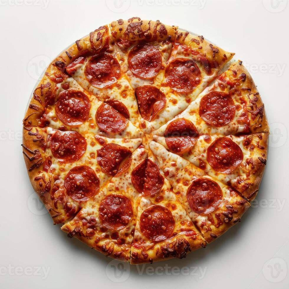 a pepperoni pizza on a white table with a slice missing photo