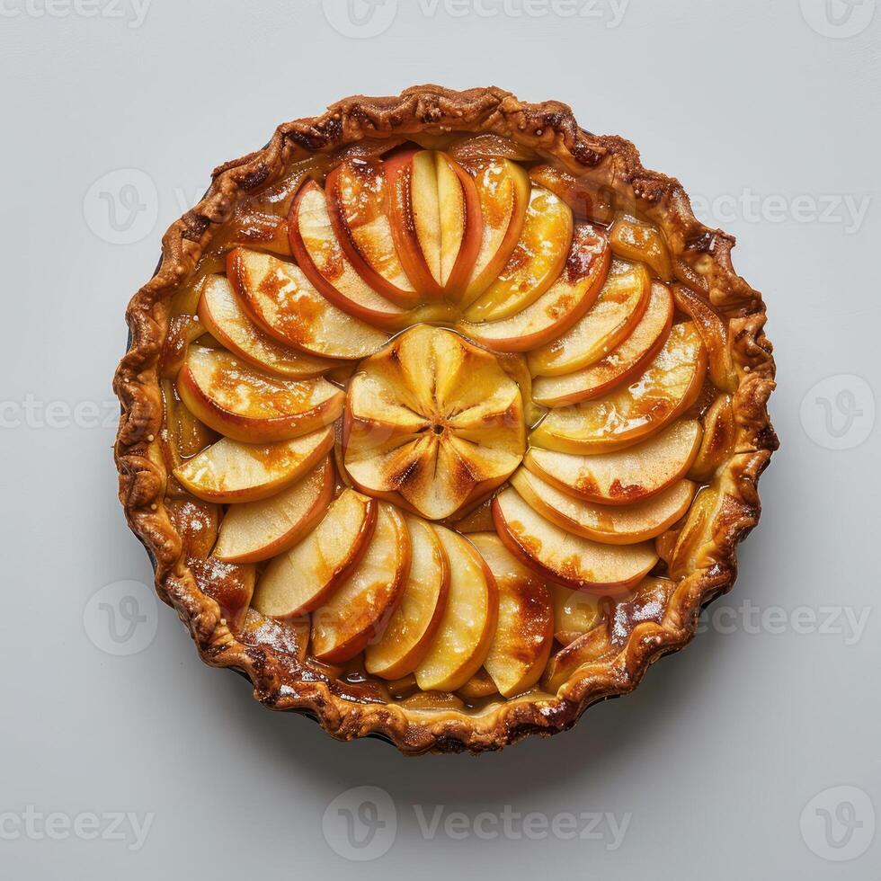 a pie with apples on top of it on a table photo