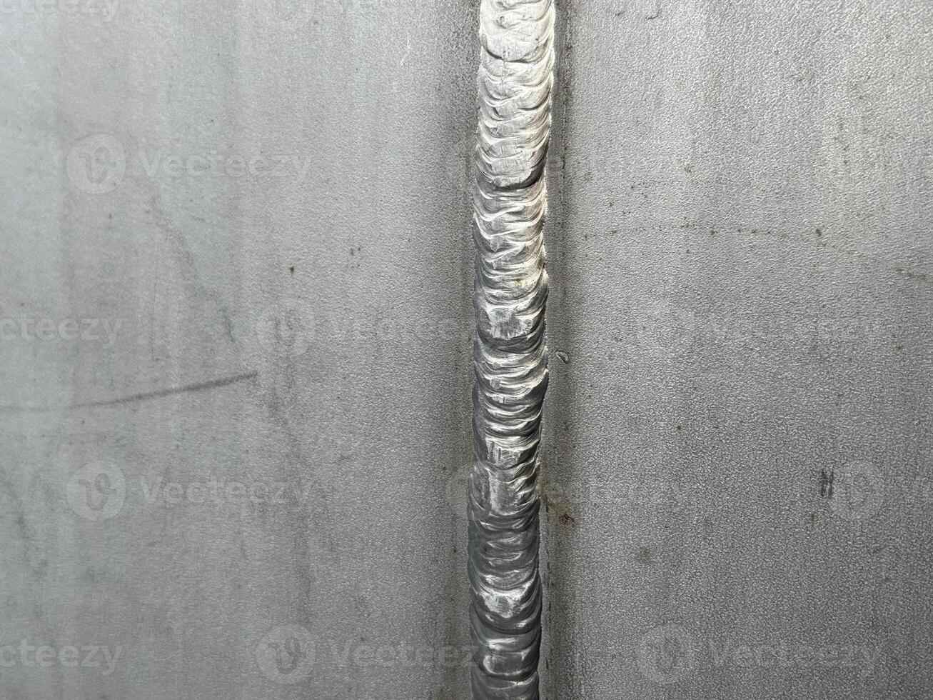 Stainless Steel Welding Seam Close-up image of a precise and expertly executed welding seam on a stainless steel surface, showcasing the intricate detail of the weld. photo