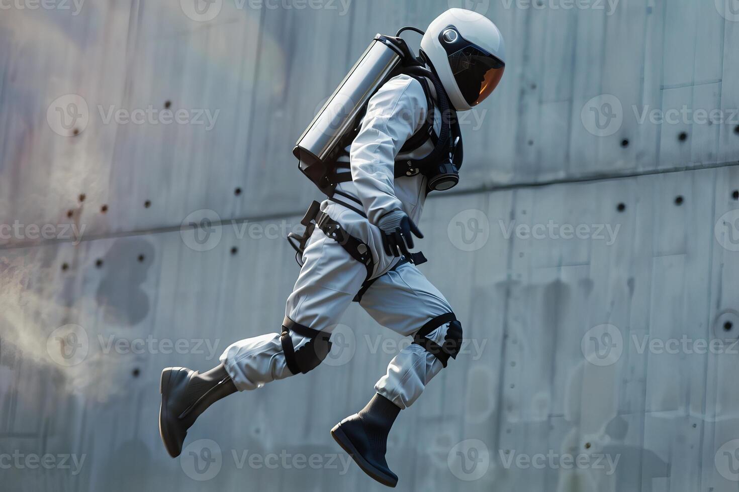 Astronaut running and jumping in futuristic protective gear photo