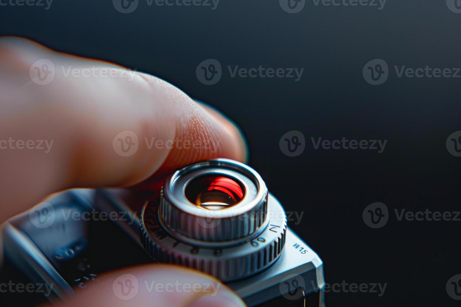 Photographer setting shutter speed on vintage camera close up photo