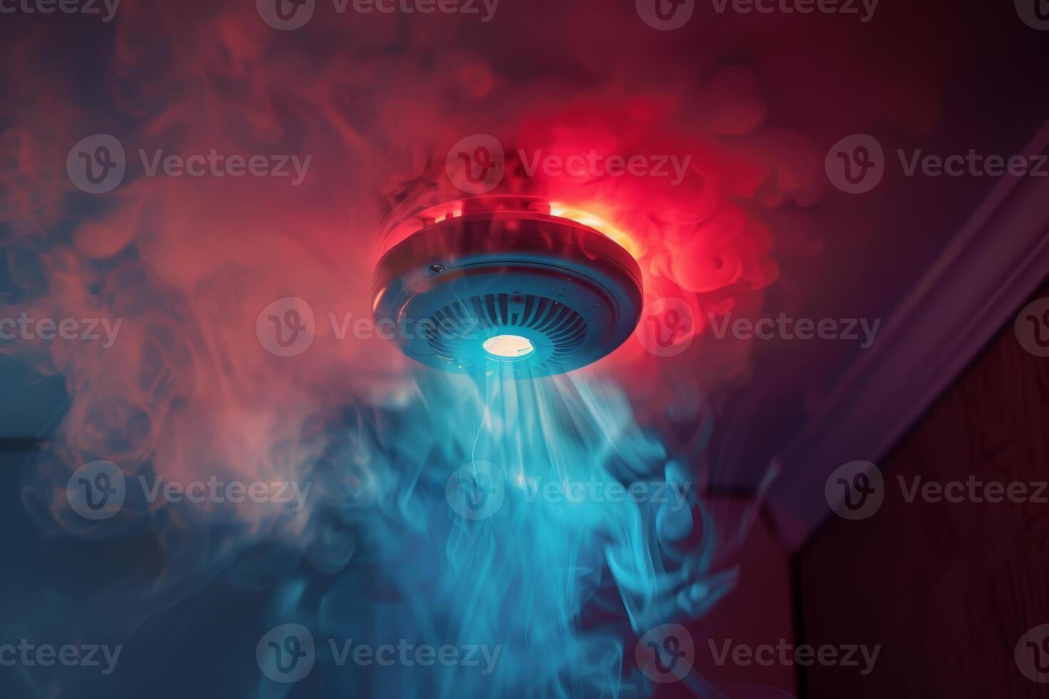 Smoke detector flashing and beeping detecting a fire photo