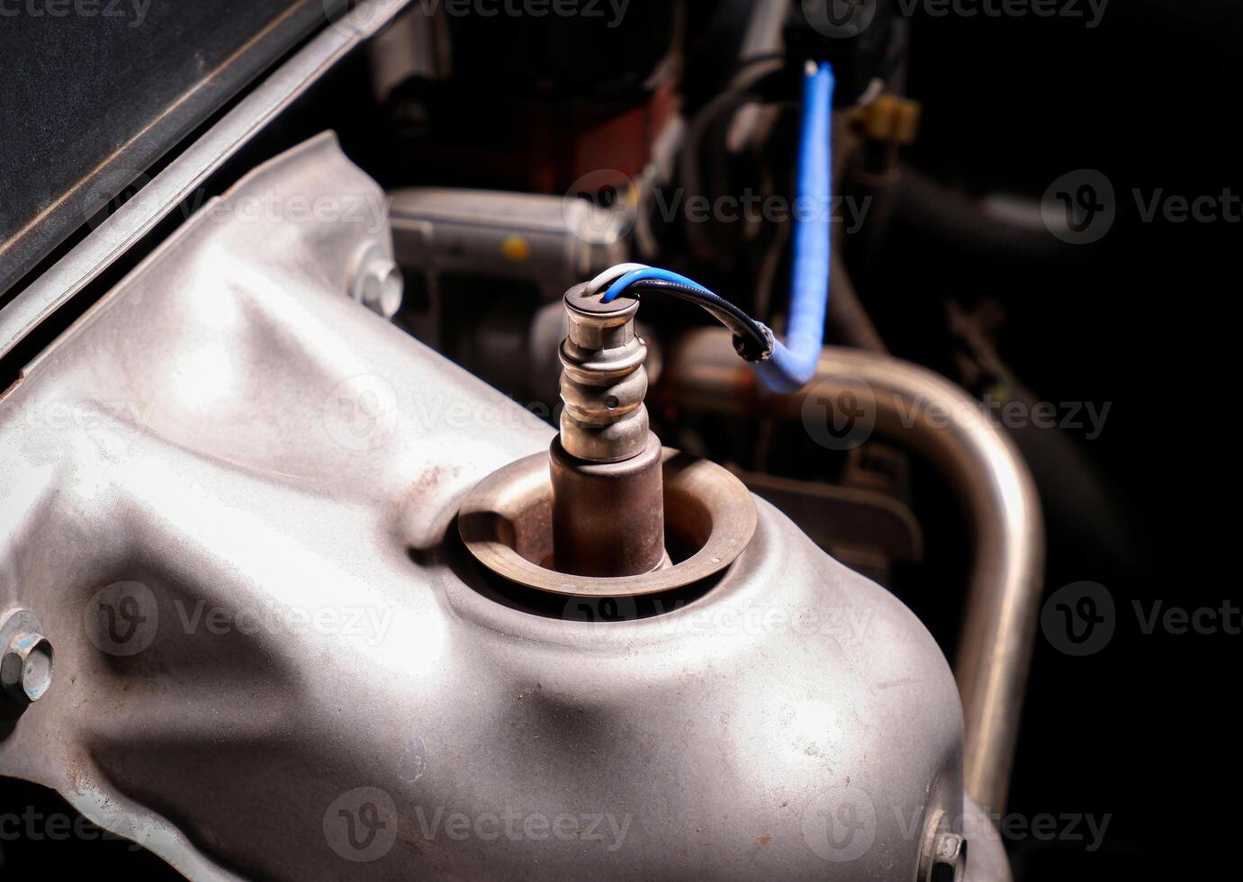 O2 sensor or oxygen sensor on exhaust pipe for measures the level of oxygen remaining from combustion in engine exhaust , Car parts concept photo