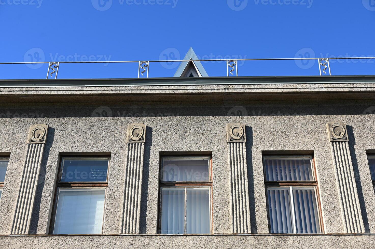 a building with a clock on the top of it photo