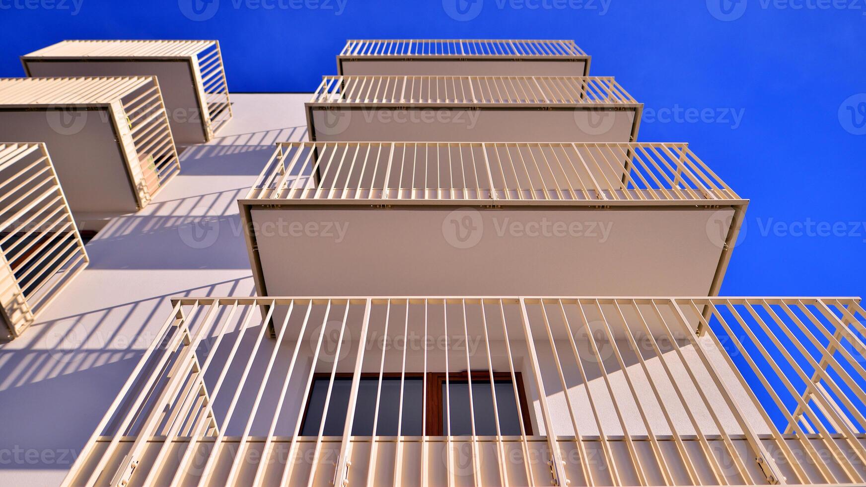 Modern apartment buildings on a sunny day with a blue sky. Facade of a modern apartment building. photo