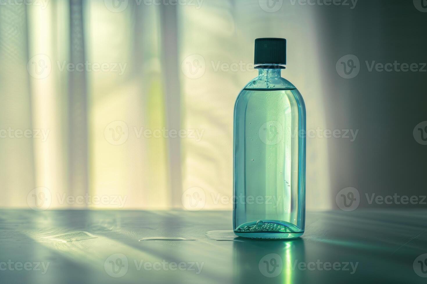 Transparent bottle filled with liquid standing on table and casting shadow photo