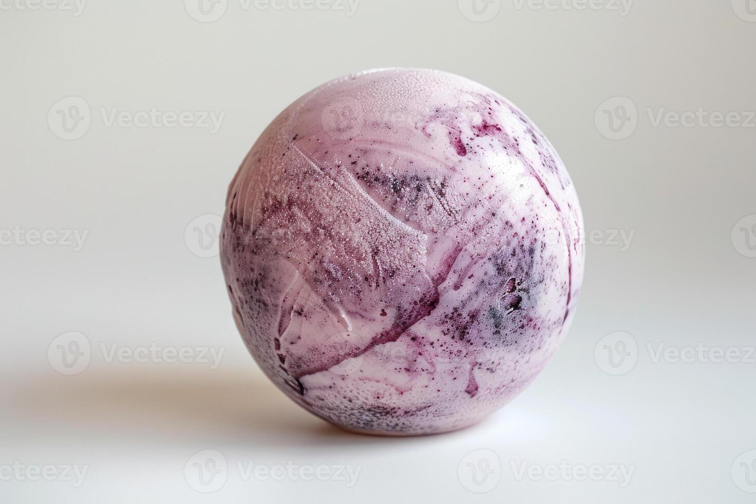 Single scoop of blueberry ice cream melting on white background photo