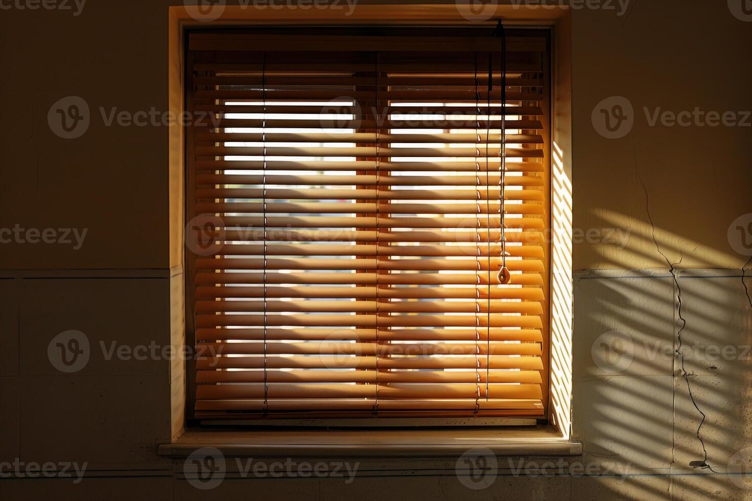 Sunlight shining through window blinds casting shadows on wall photo