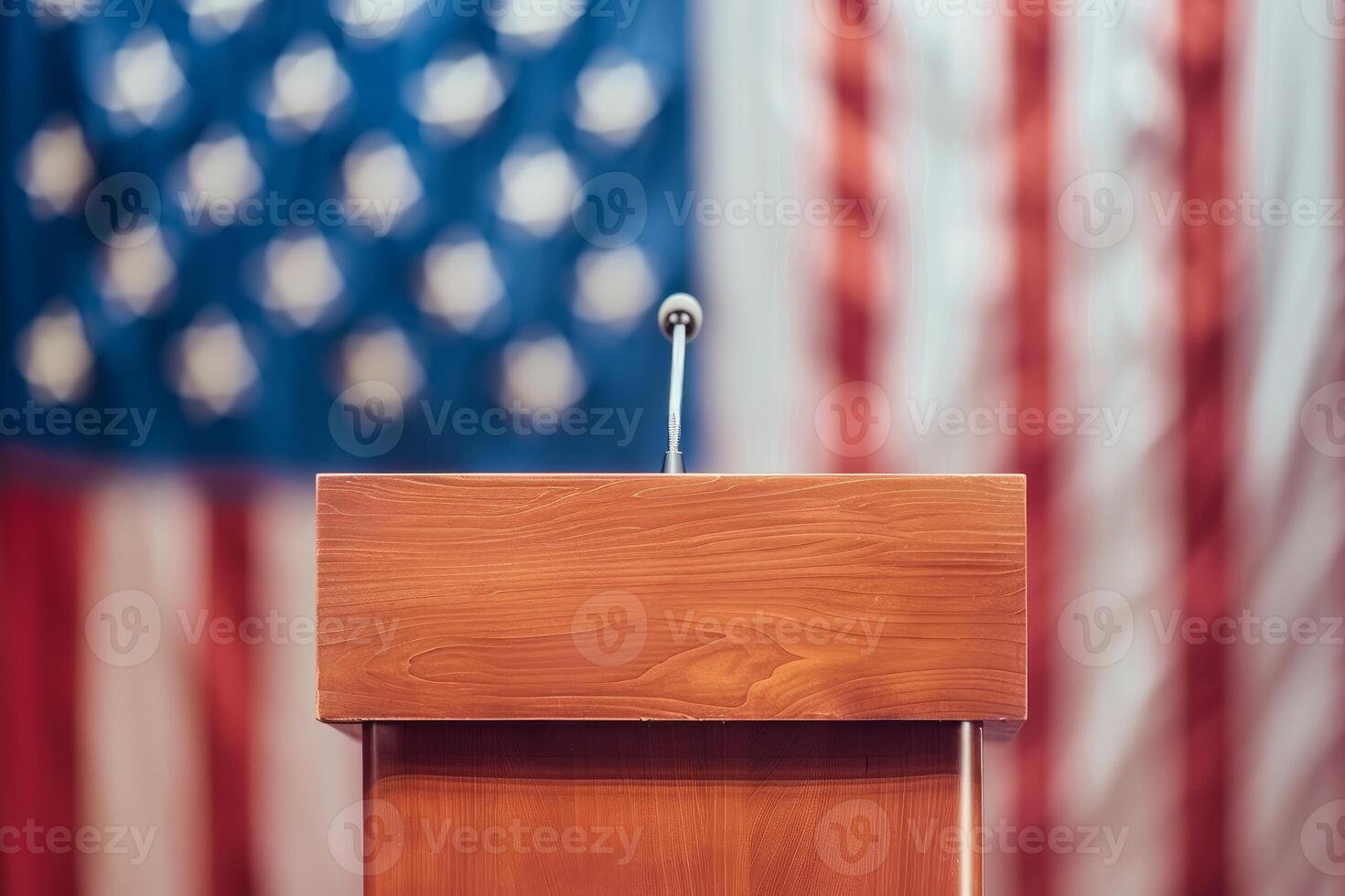Wooden podium with microphone standing in front of american flag photo
