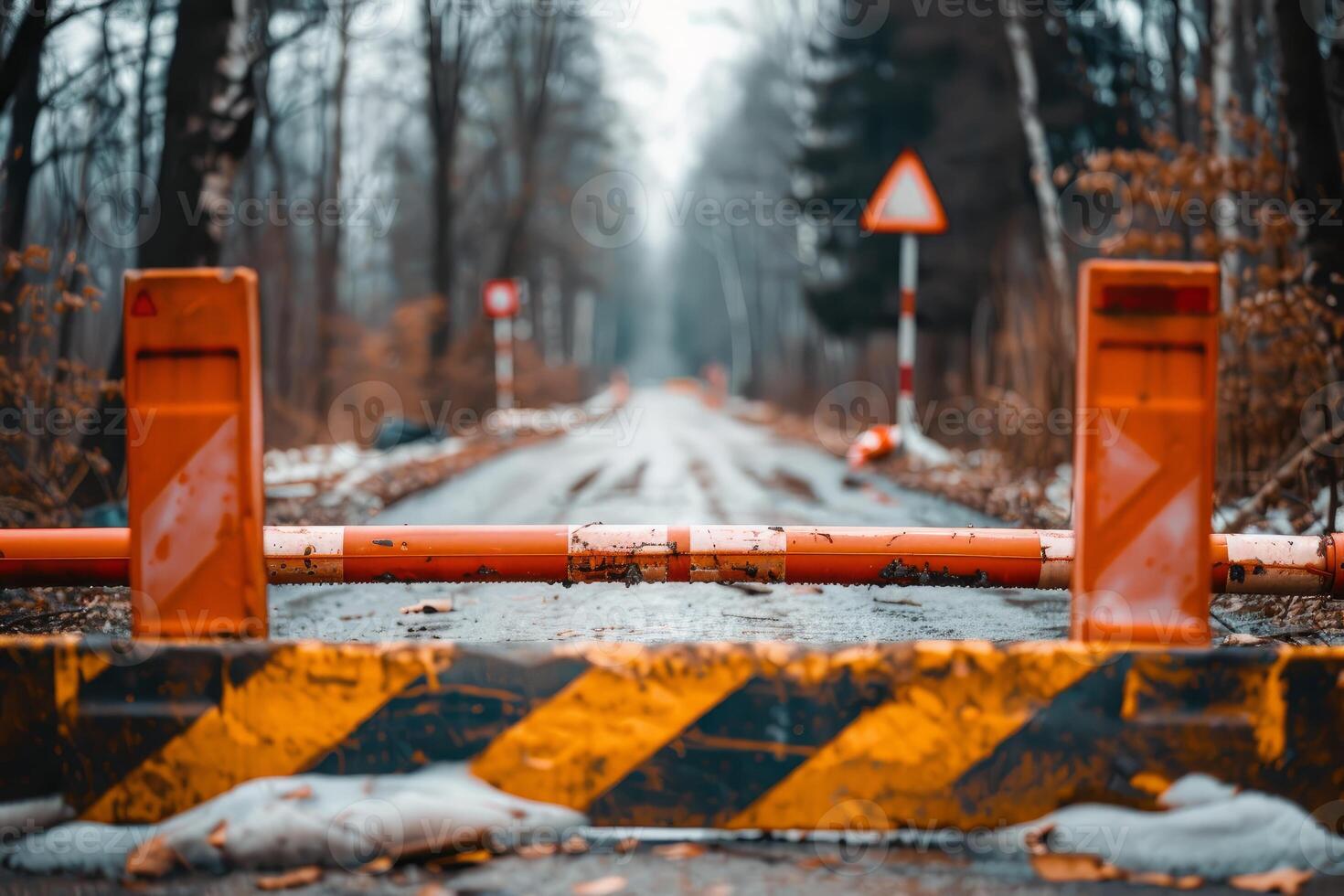Closed forest road with barrier gate blocking access photo
