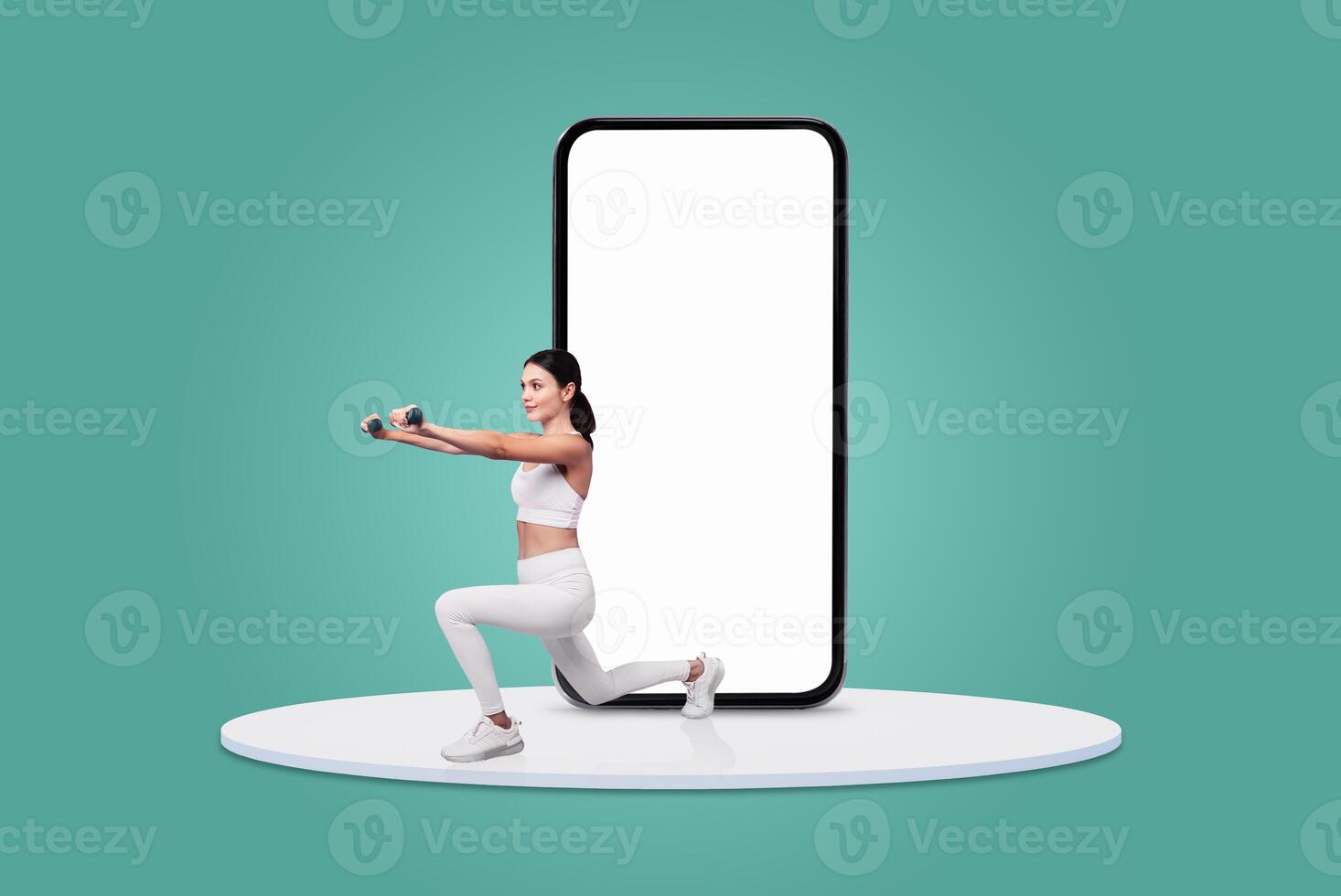 A woman in activewear performs a lunge with dumbbells while facing a large blank mobile device. The setting is bright and modern, showcasing a focus on fitness and technology. photo