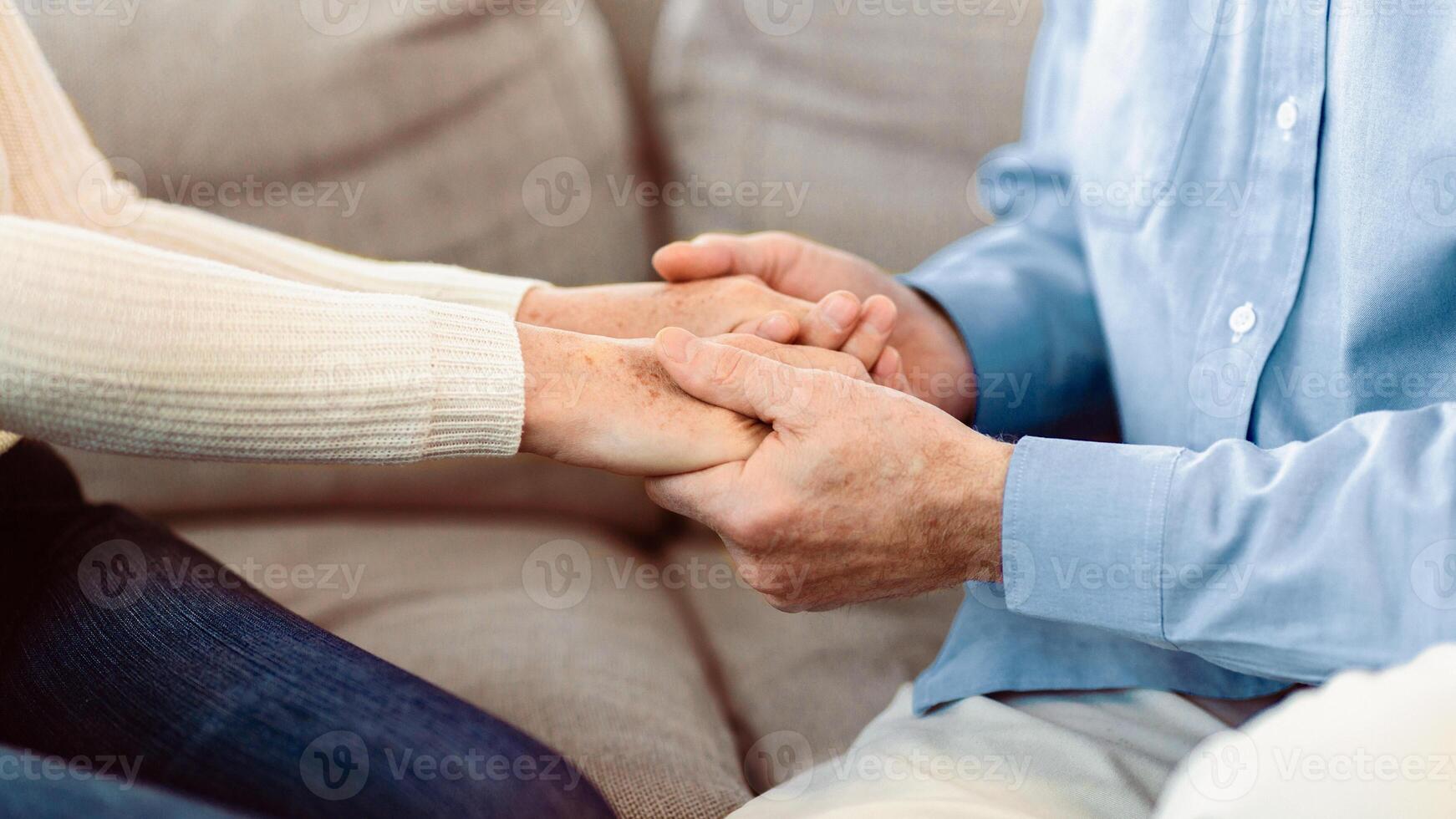 Couple Therapy. Cropped image of mature couple holding hands at psychotherapy session, empty space, panorama photo