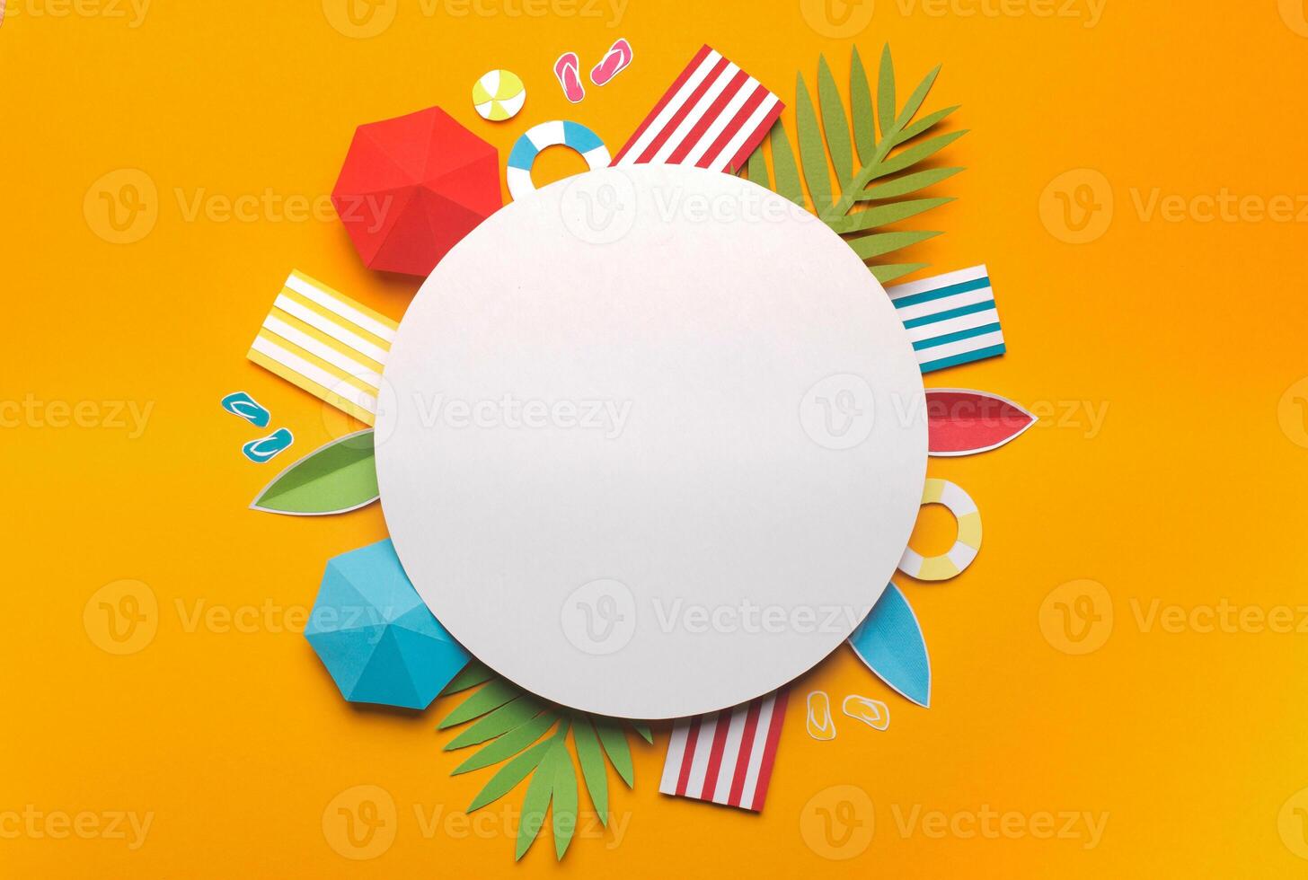 Summer vacation concept. Composition of beach accessories on yellow background with round white blank space, paper photo