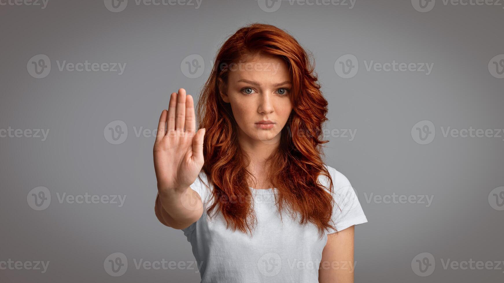 Stay At Home. Determined Girl Gesturing Stop Forbidding And Warning About Danger Posing Over Gray Studio Background. Panorama photo