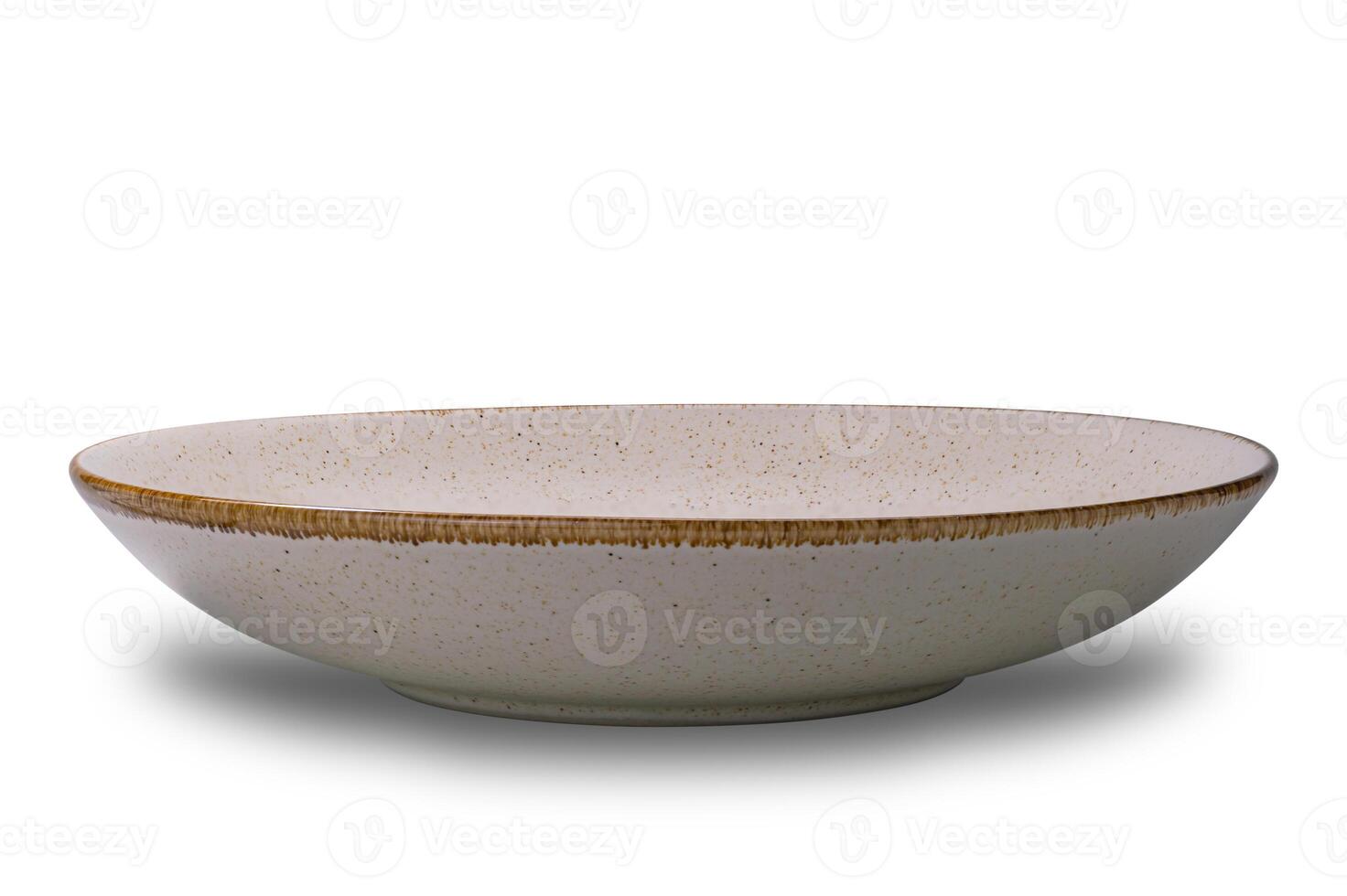 Closeup view of empty spotted brown ceramic bowl with dark edge isolated on white background with clipping path. photo