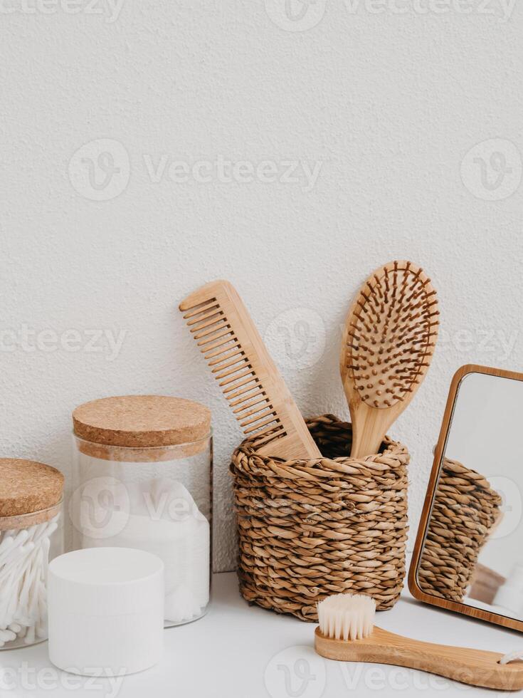 Bath background front view with straw box, container with toothbrushes, cosmetics photo