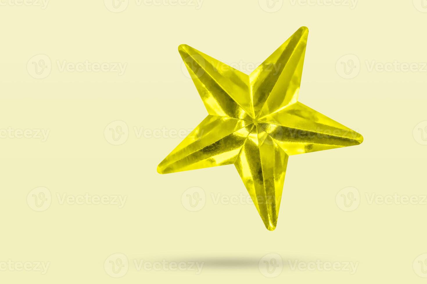 golden Christmas star jewels sticker isolated on yellow background photo