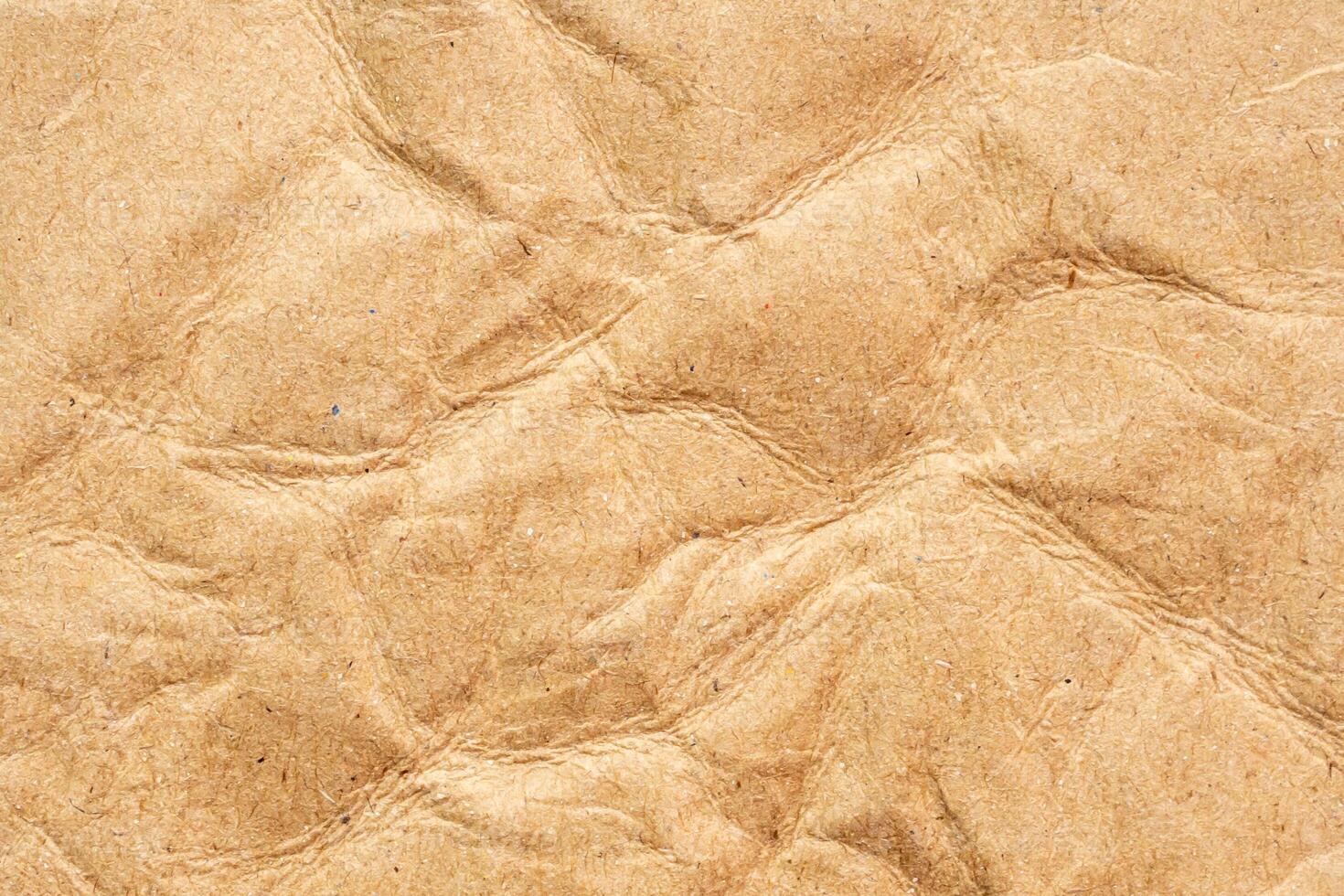 Abstract crumpled and creased recycle brown paper texture background photo