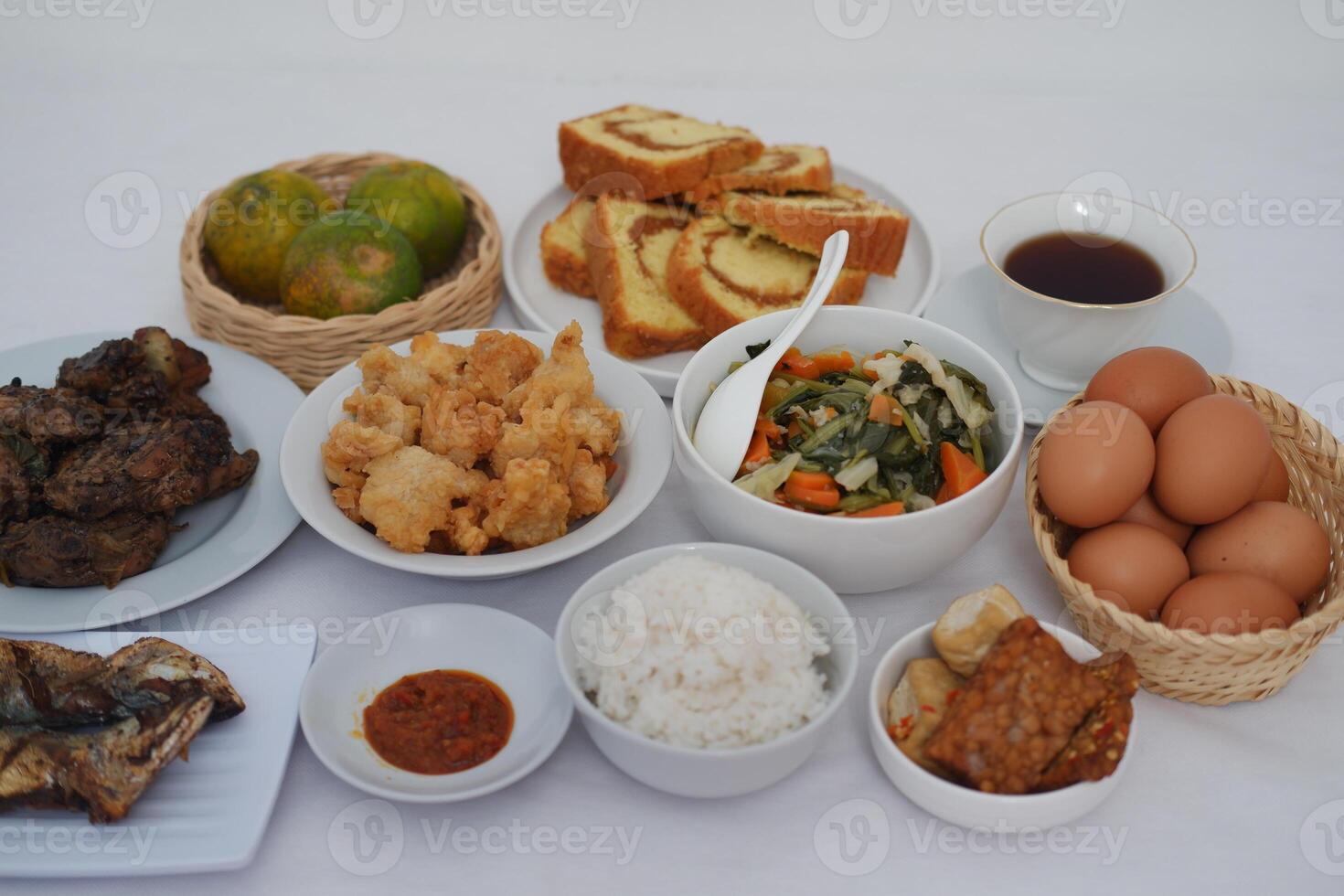 traditional Indonesian food arranged neatly on a white surface photo