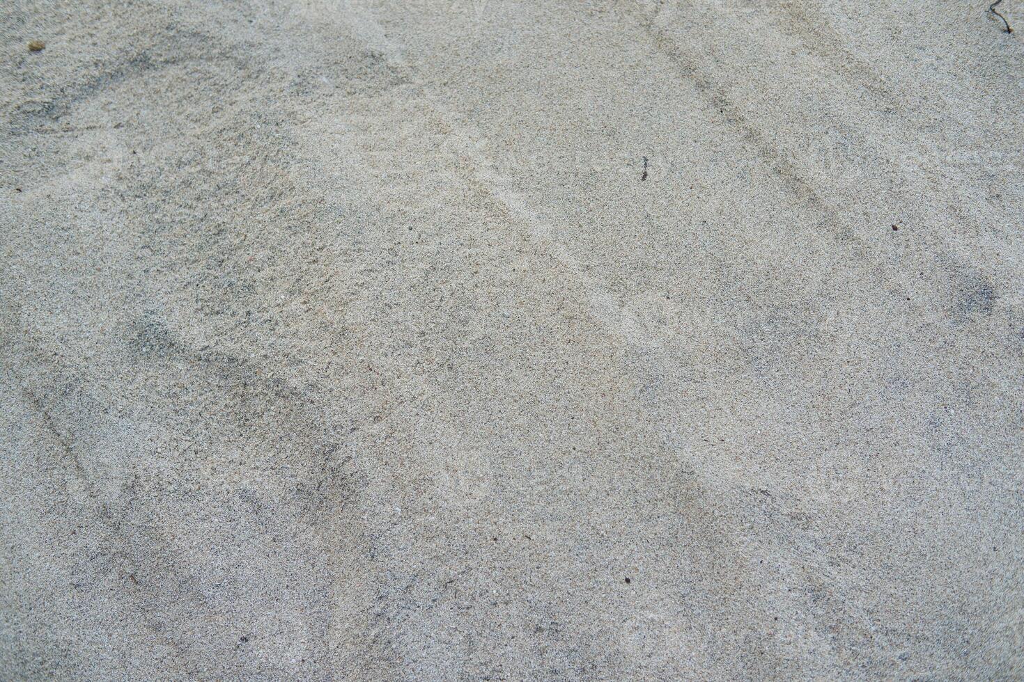 Close-up Texture of Sandy Surface photo