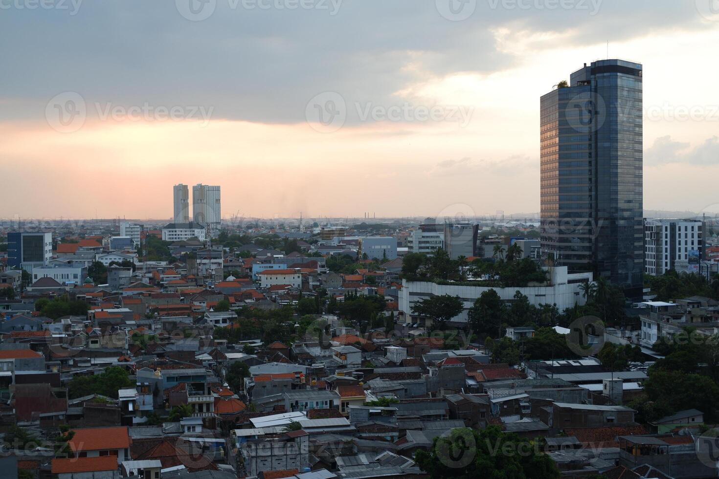 Panoramic view of surabaya city at sunset photo