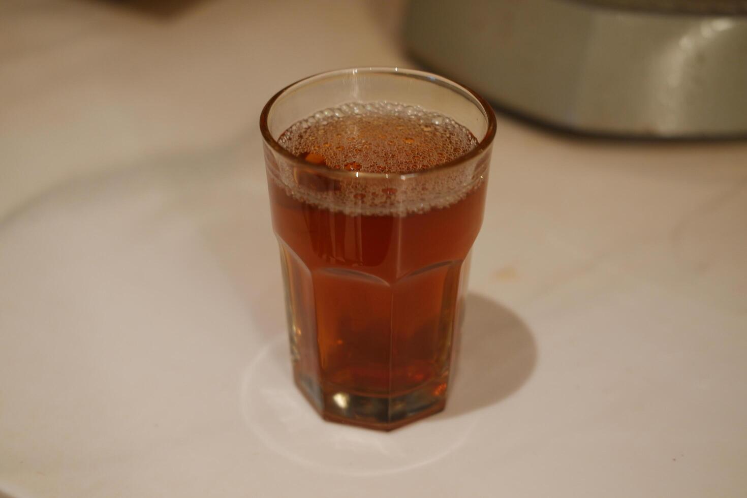 hot tea in glass on table. Selective focus and shallow depth of field. photo