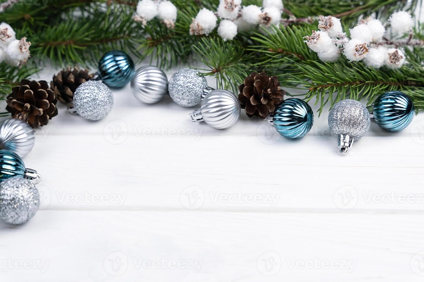 Christmas festive background with fir branches and Christmas tree decorations. Top view. Close-up. Copy space. photo