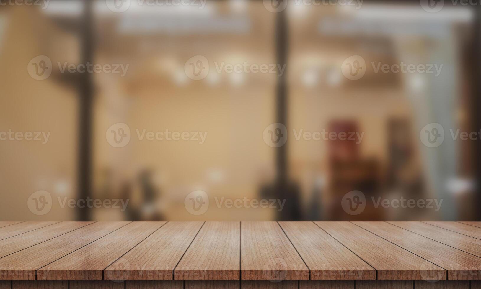Empty wooden table top with lights bokeh on blur restaurant background. photo