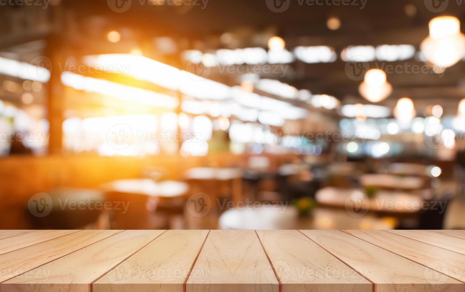 Empty wooden table top with lights bokeh on blur restaurant background. photo