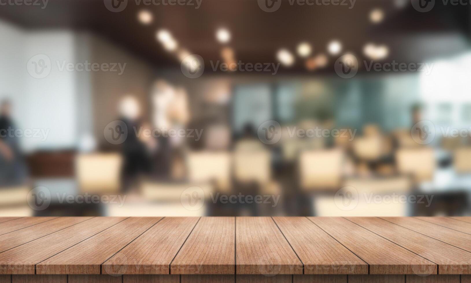 Empty wooden table top with lights bokeh on blur restaurant background. photo