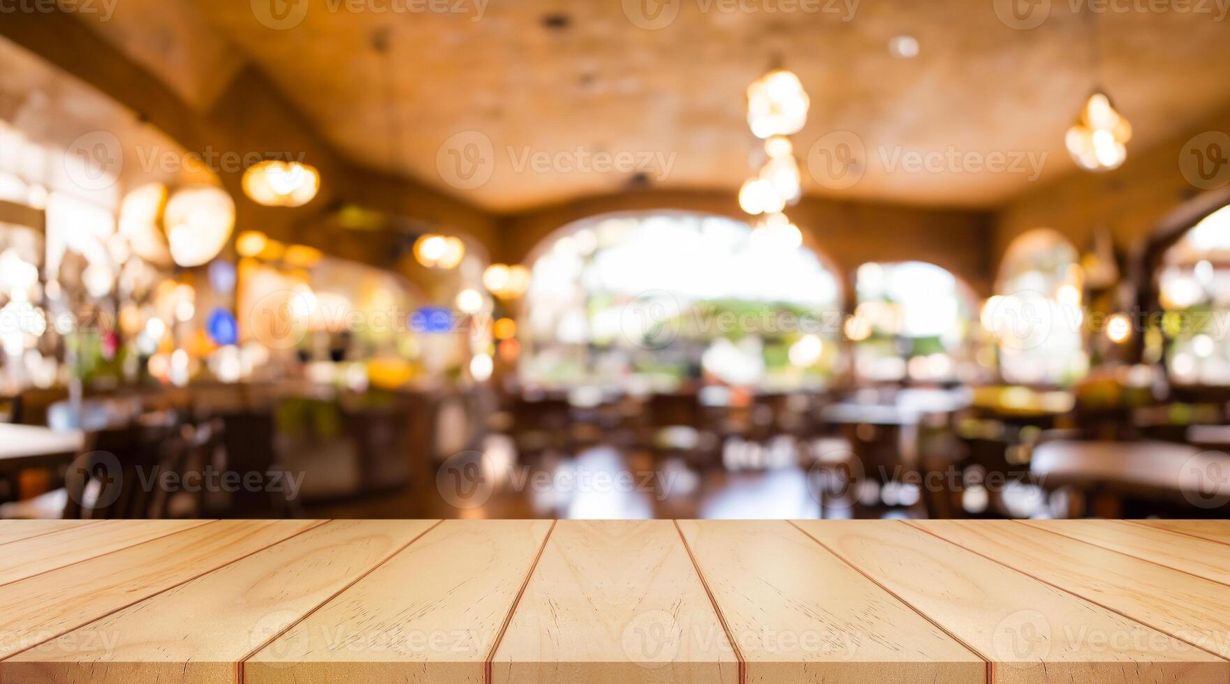 Empty wooden table top with lights bokeh on blur restaurant background. photo