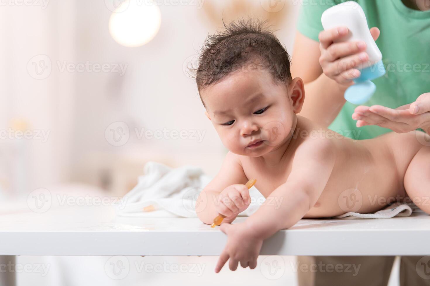 After bath time, it's time to put on powder and get dressed photo