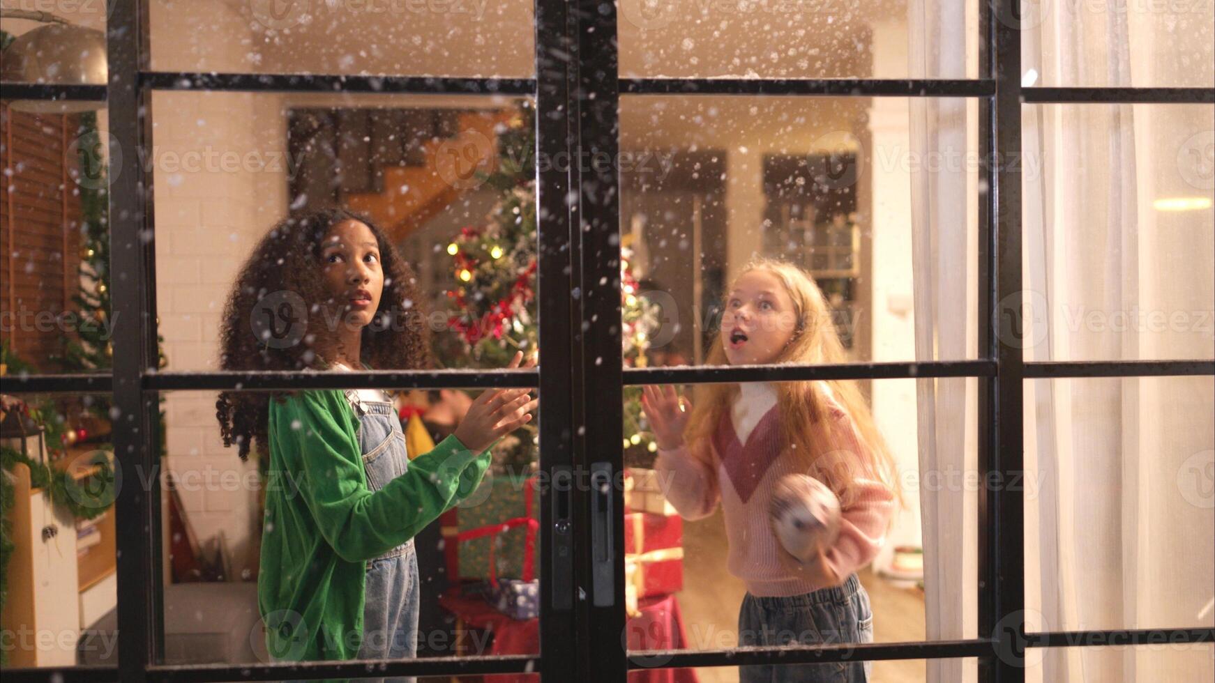Parents and a teen girl on Christmas night with the first snowfall photo