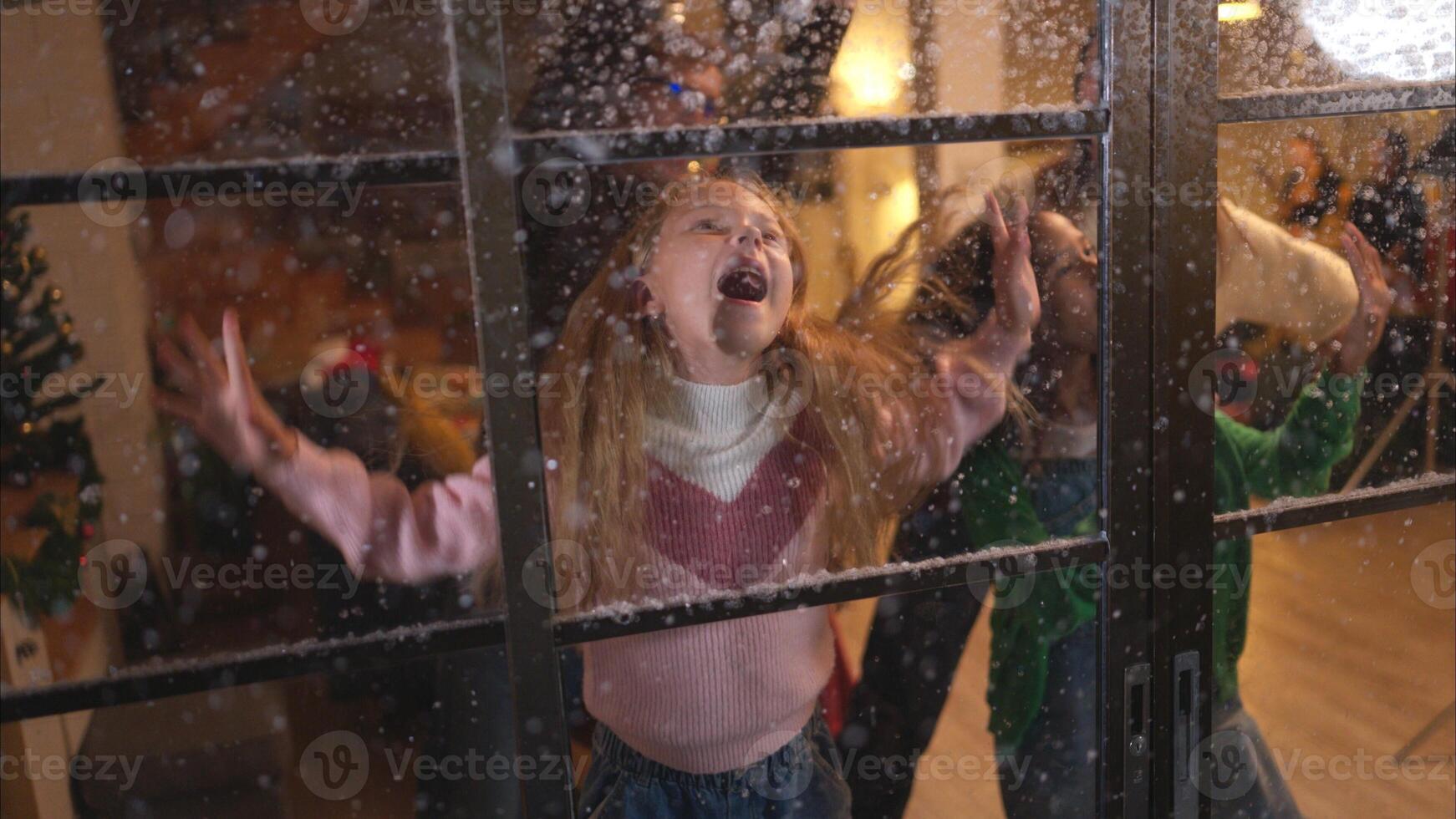 Parents and a teen girl on Christmas night with the first snowfall photo