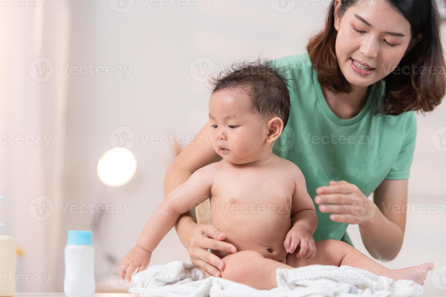 After bath time, it's time to put on powder and get dressed photo