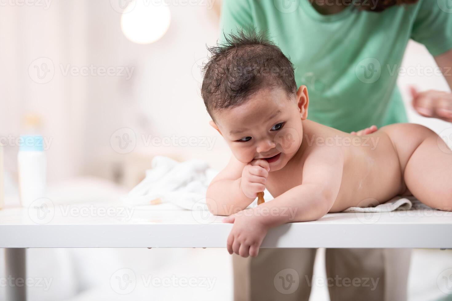 After bath time, it's time to put on powder and get dressed photo