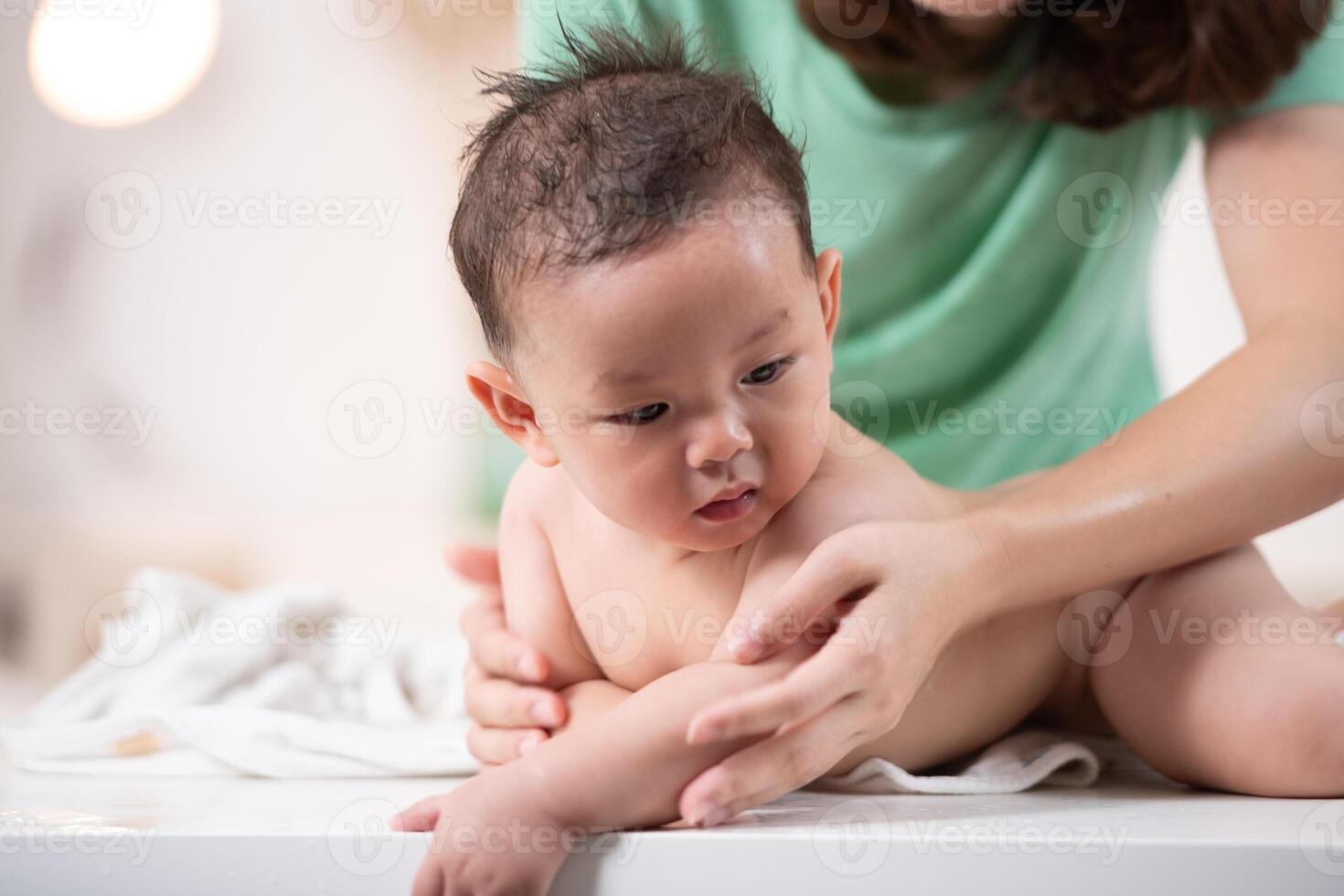 After bath time, it's time to put on powder and get dressed photo