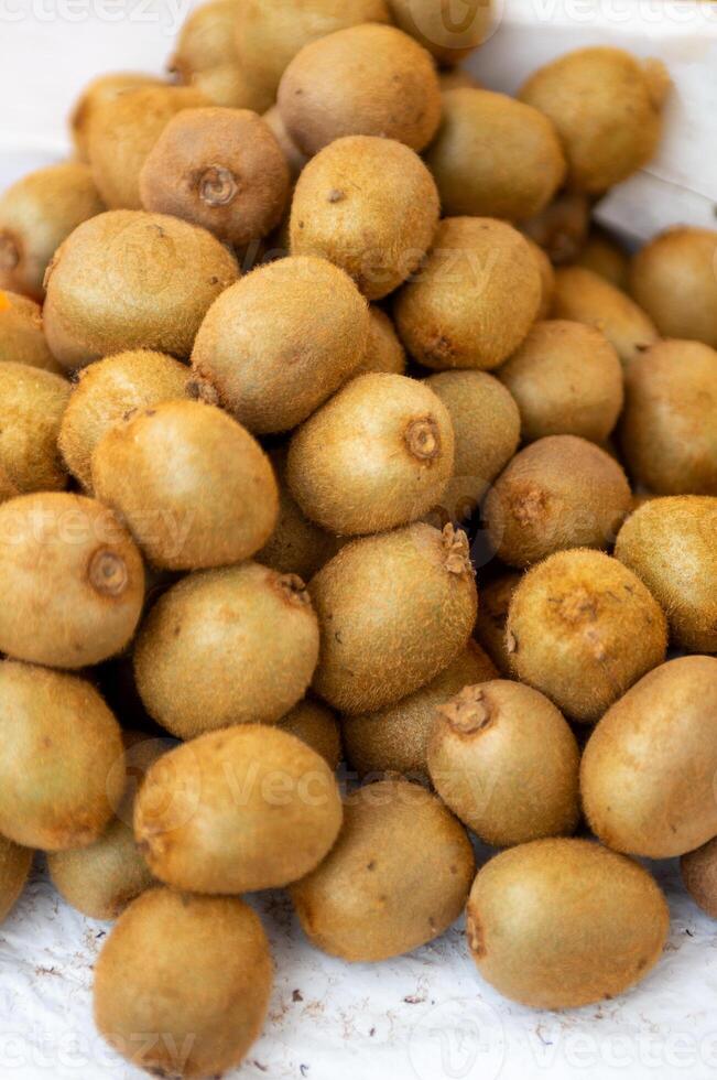 Bunches of golden kiwis photo