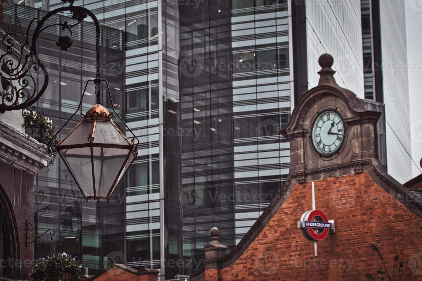 Modern Skyscraper, Brick Building, and Lantern in Hammersmith, London photo